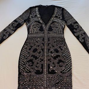 Sheer black sequence dress.